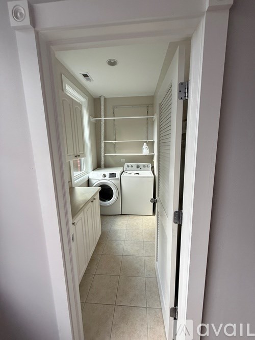 A laundry room with a washer and dryer.