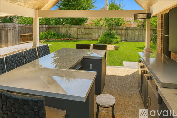 A patio with a table and chairs is shown.