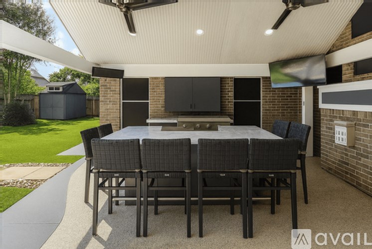 A patio with a table and chairs is shown.