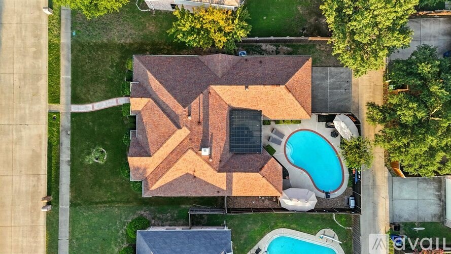 A house with a pool in the backyard.