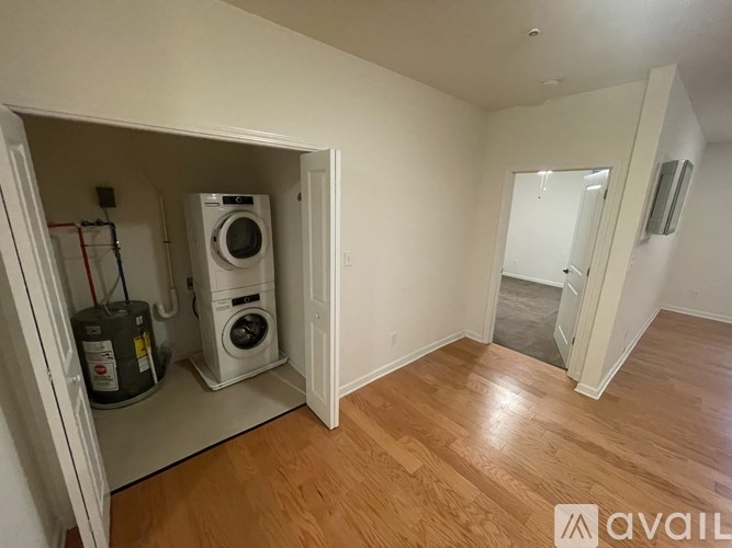 A laundry room with a washer and dryer in it.