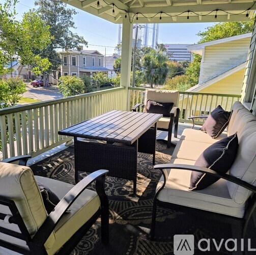 A patio with a table and chairs is available for rent.