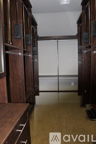 A room with wooden cabinets and a glass door.