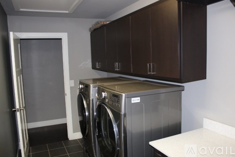 A laundry room with a washer and dryer.