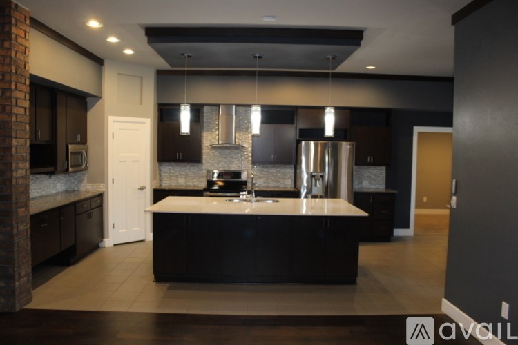 A modern kitchen with a large island in the middle.