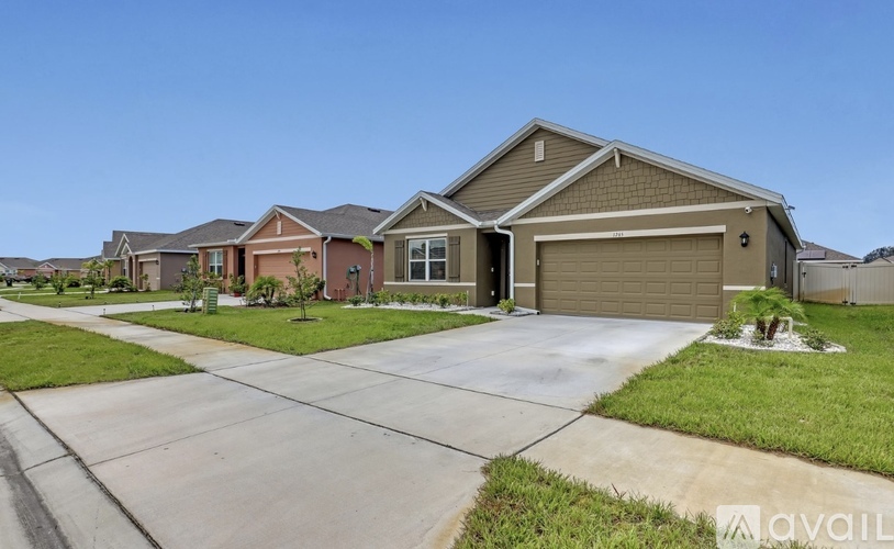 A house with a garage is available for sale.