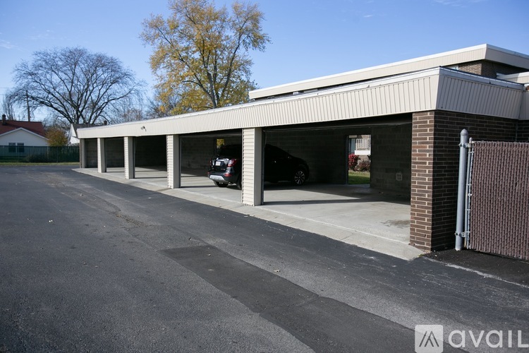 A parking lot with a building in the background.