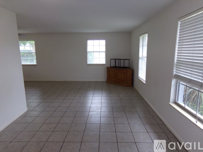 A room with white walls and a tiled floor.