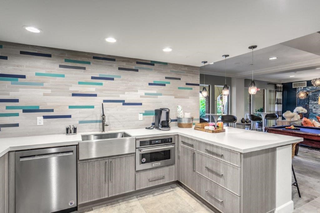 a kitchen with stainless steel appliances and a counter top