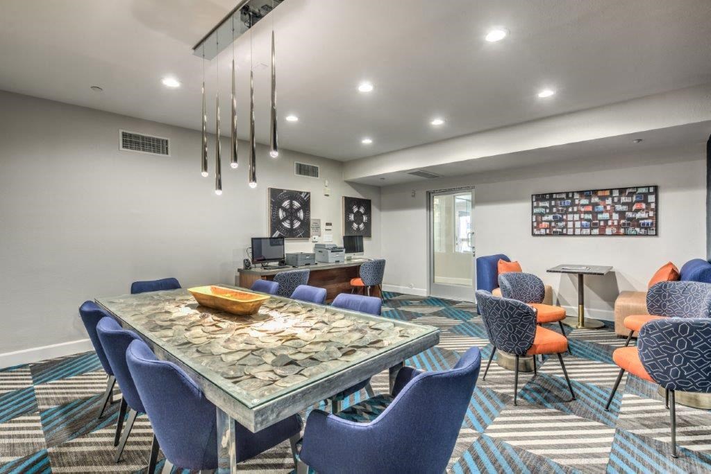 a conference room with a table and chairs
