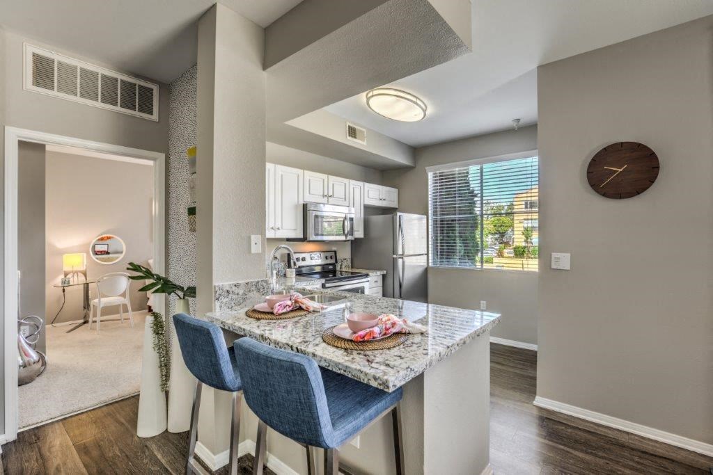 a kitchen with a marble counter top