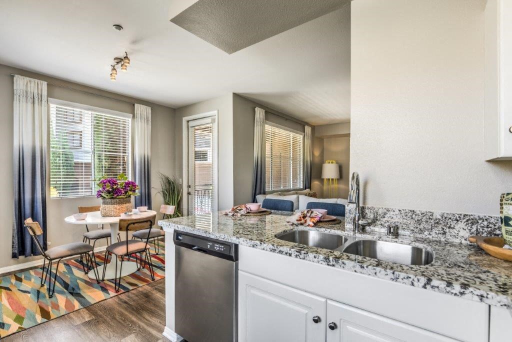 a kitchen with a sink and a counter top