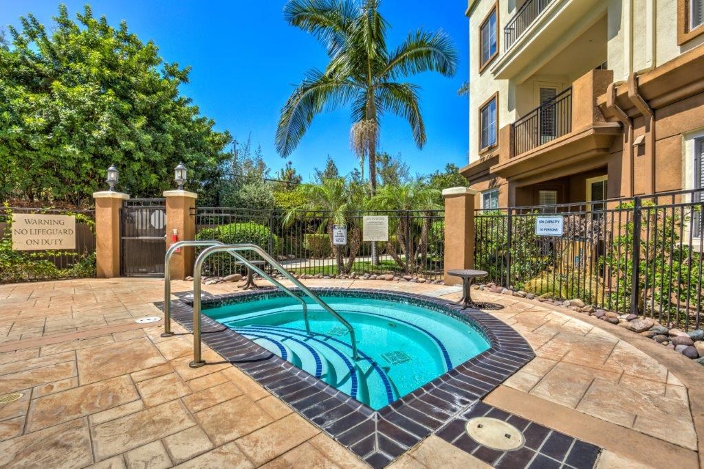 the swimming pool at the resort with palm trees