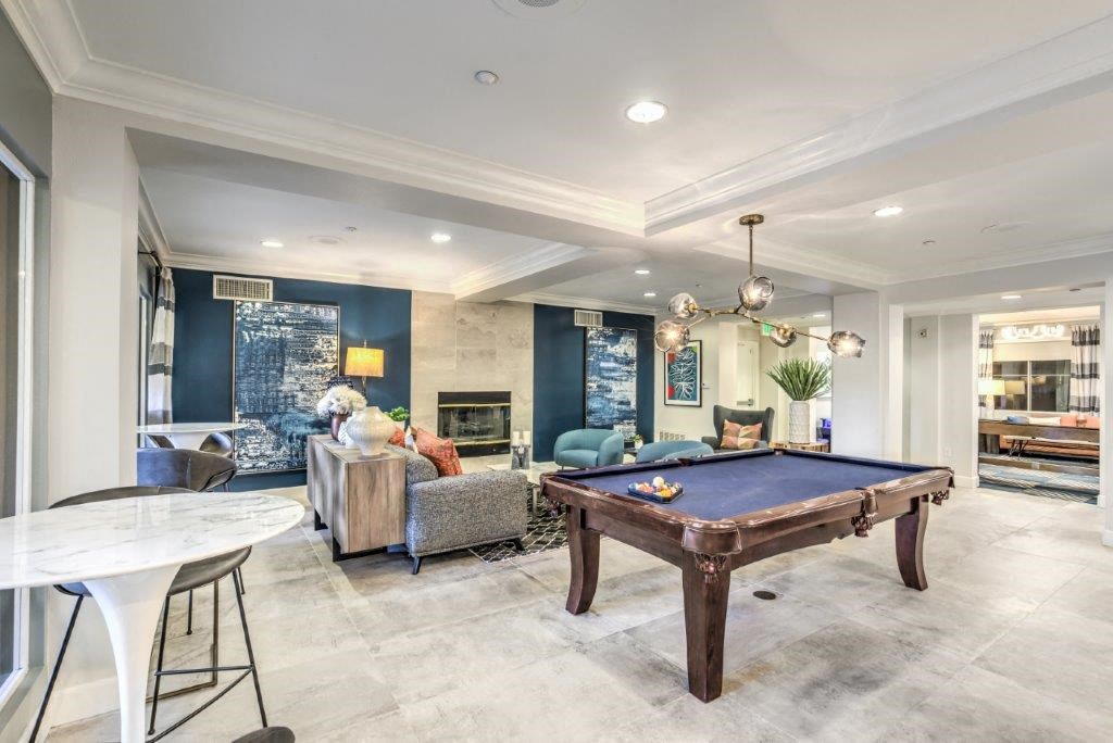 a game room with a pool table