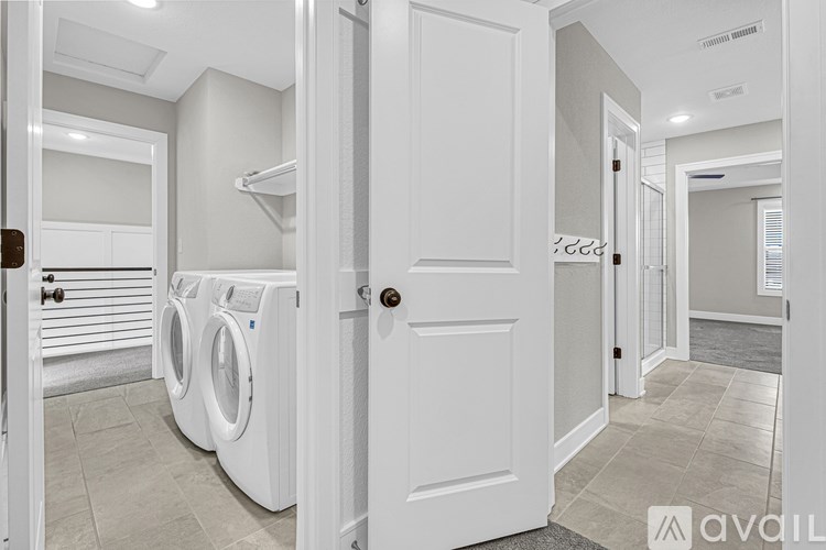 A laundry room with a washer and dryer.