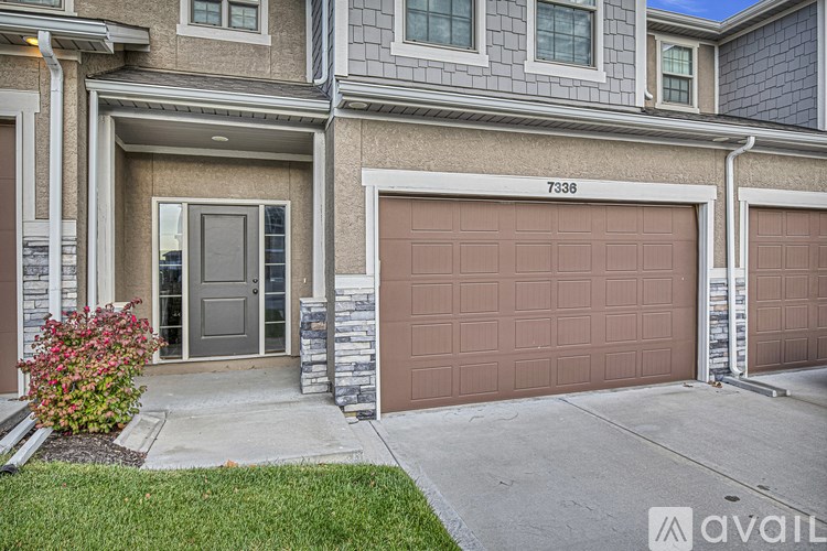 A house with the number 7338 on the front wall.