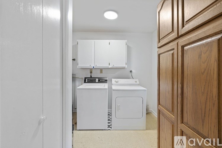 A white washer and dryer in a laundry room.