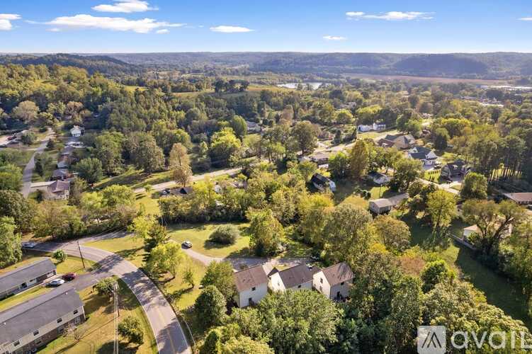 A bird's eye view of a residential area with houses and trees.