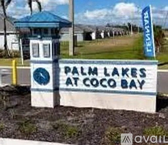 A sign that says "Palm Lakes at Coco Bay" is displayed.