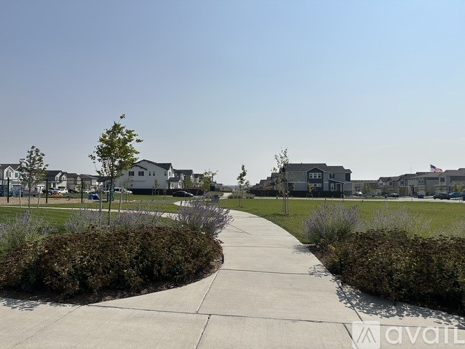 A residential area with houses and a clear sky.