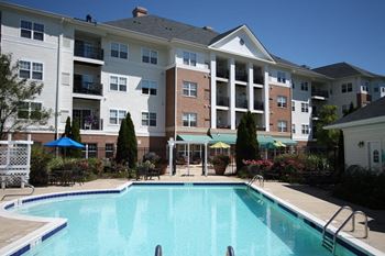 Outdoor Recreation Area with Heated Pool, Whirlpool, Putting Green and Walking Paths  at Evergreens at Smith Run, Fredericksburg, VA,22401