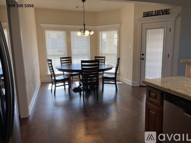 A dining room with a table and chairs is available for rent.