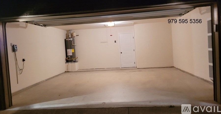 A room with a door open and a number on the wall.