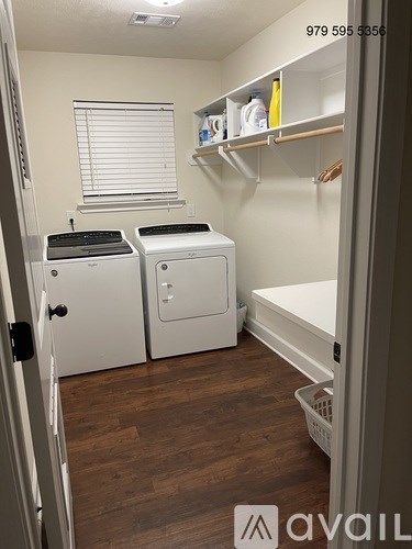 A laundry room with a washer and dryer.