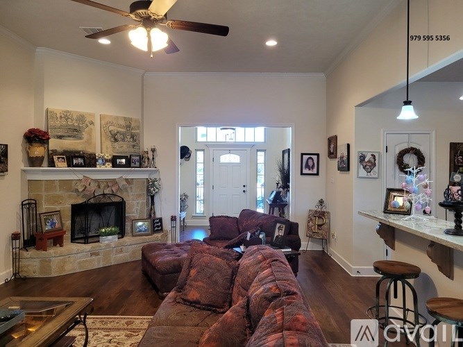 A living room with a fireplace and a couch.