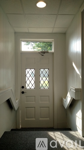 A window with a view of trees and sky.