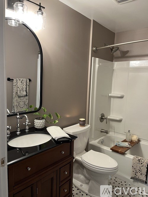 A bathroom with a white toilet and a sink.