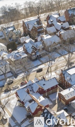 A bird's eye view of a snowy residential area.