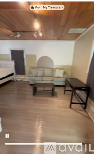 A living room with a couch and a coffee table.