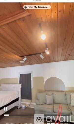 A room with a bed and a couch.