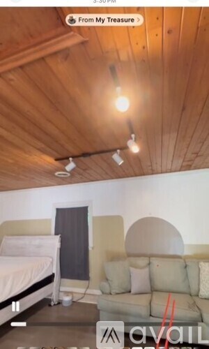 A room with a bed and a couch.