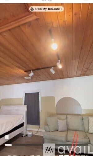 A room with a bed and a couch.