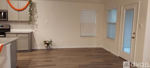A kitchen with a counter and a fridge.