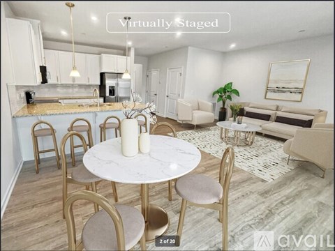 A virtual staging of a modern kitchen and living room with a dining table set for four.