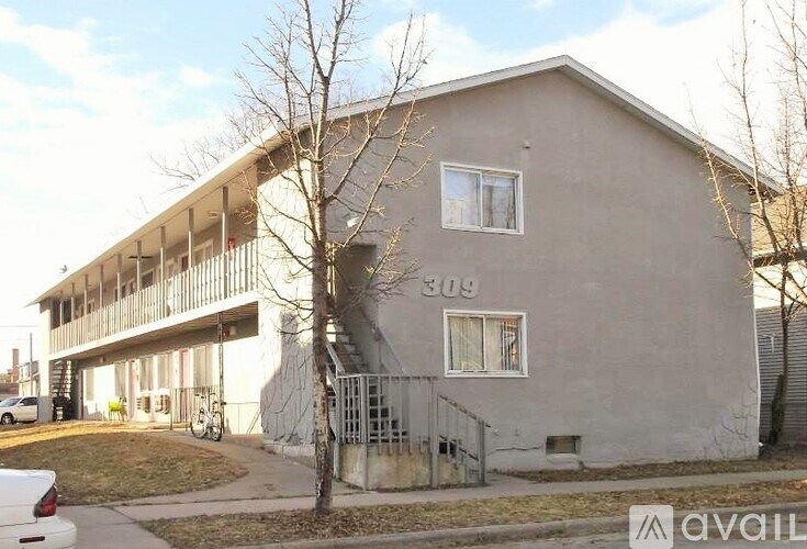 A grey building with the number 309 on it.