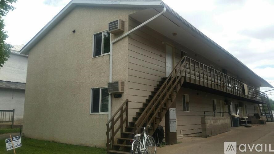 A house with a bicycle parked in front of it.