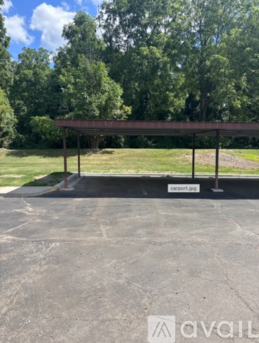 A covered parking area with a sign that reads "carport jpg".