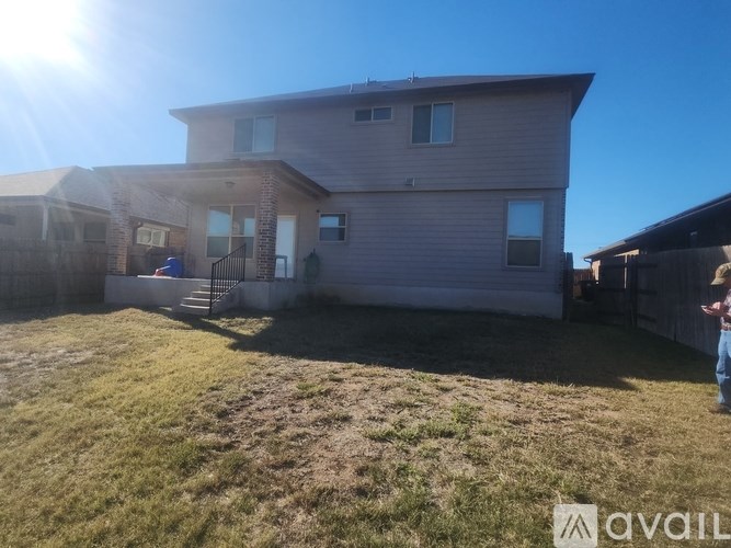 A house with a yard is for sale.