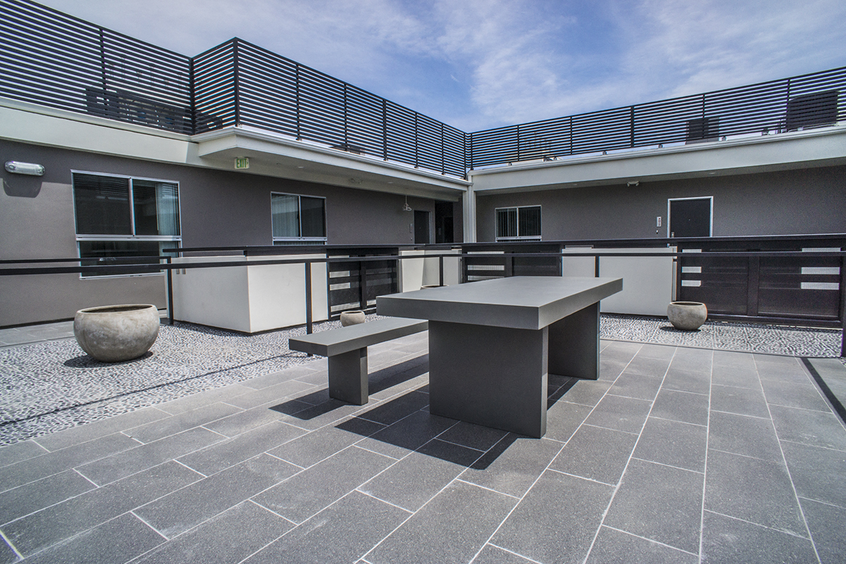 Courtyard Rooftop with Tables and Benches for Entertaining