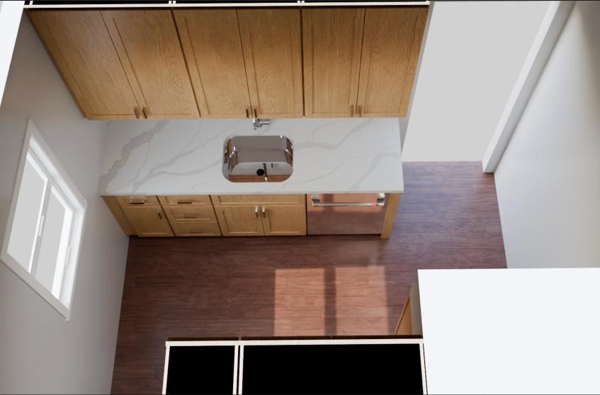 A kitchen with wooden cabinets and a marble countertop.