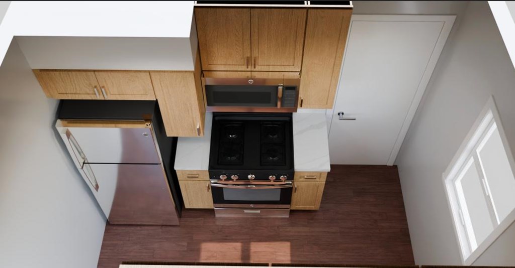 A modern kitchen with wooden cabinets and a black oven.