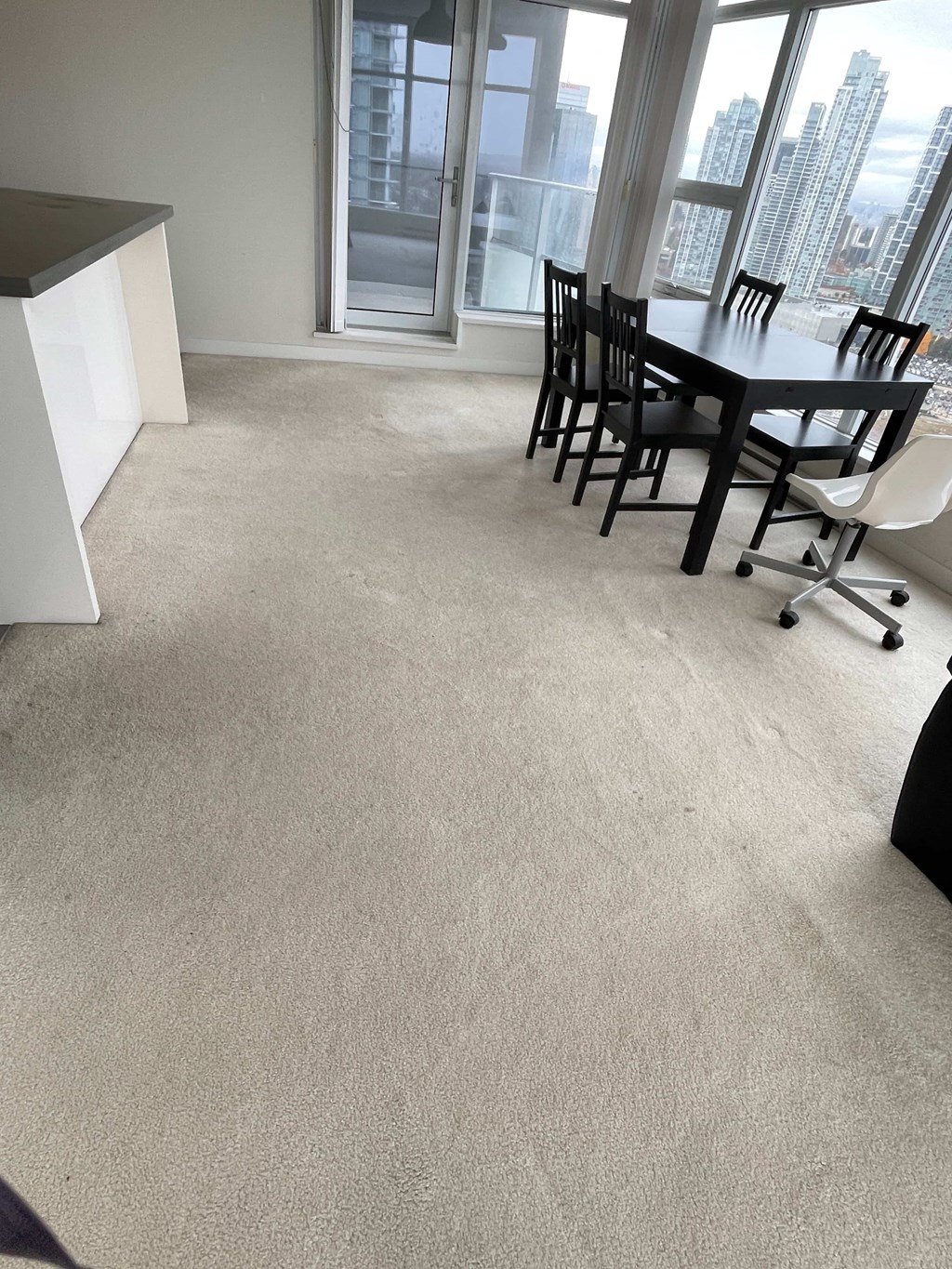 A conference room with a table and chairs.