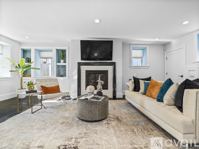 A living room with a fireplace and a couch.