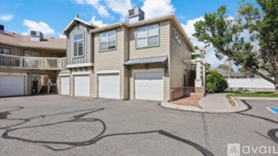 A two-story house with a garage is available for rent.