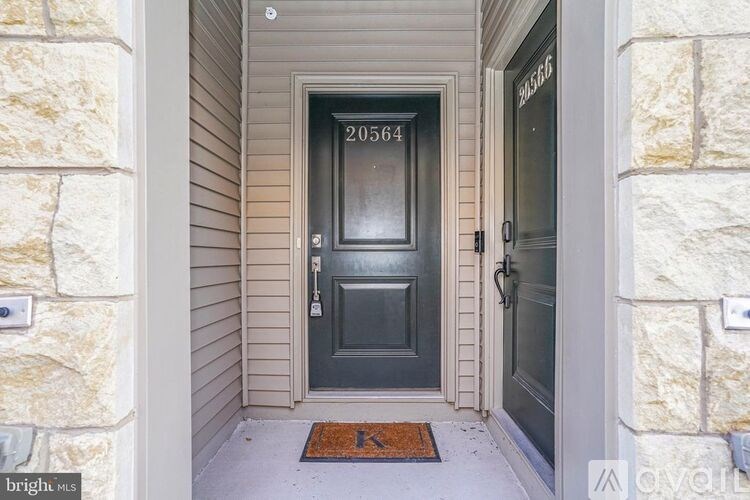 A black door with the number 20564 on it.