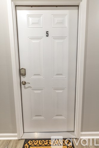 A white door with a number 5 on it.